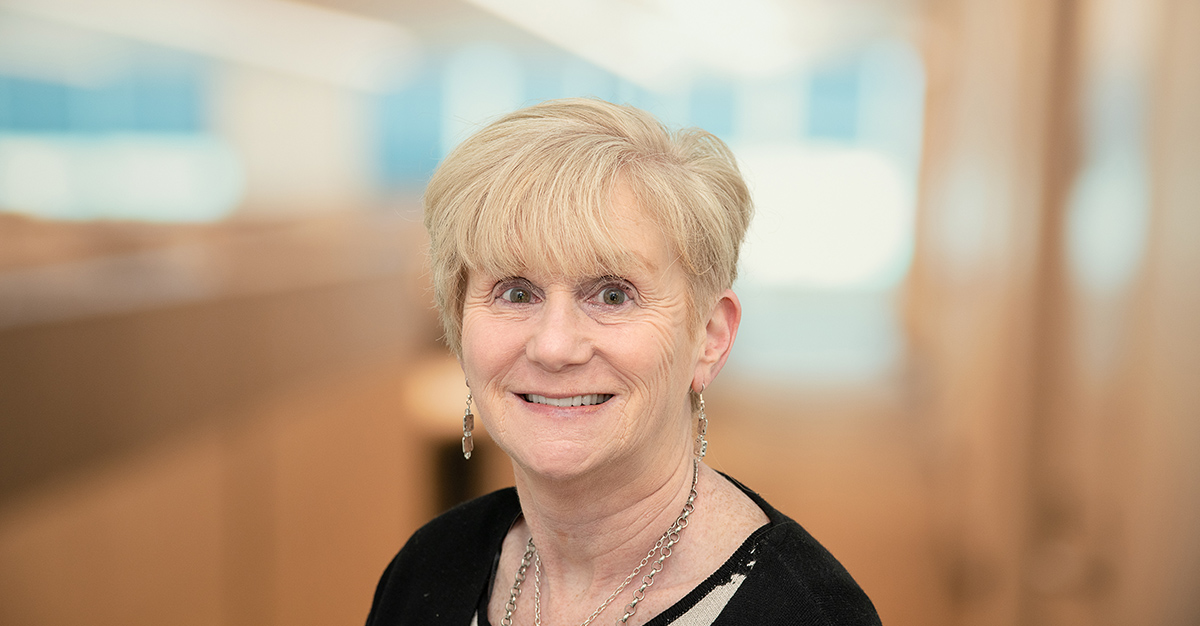 Headshot of Karen Devaney, and Atria Senior Living employee.