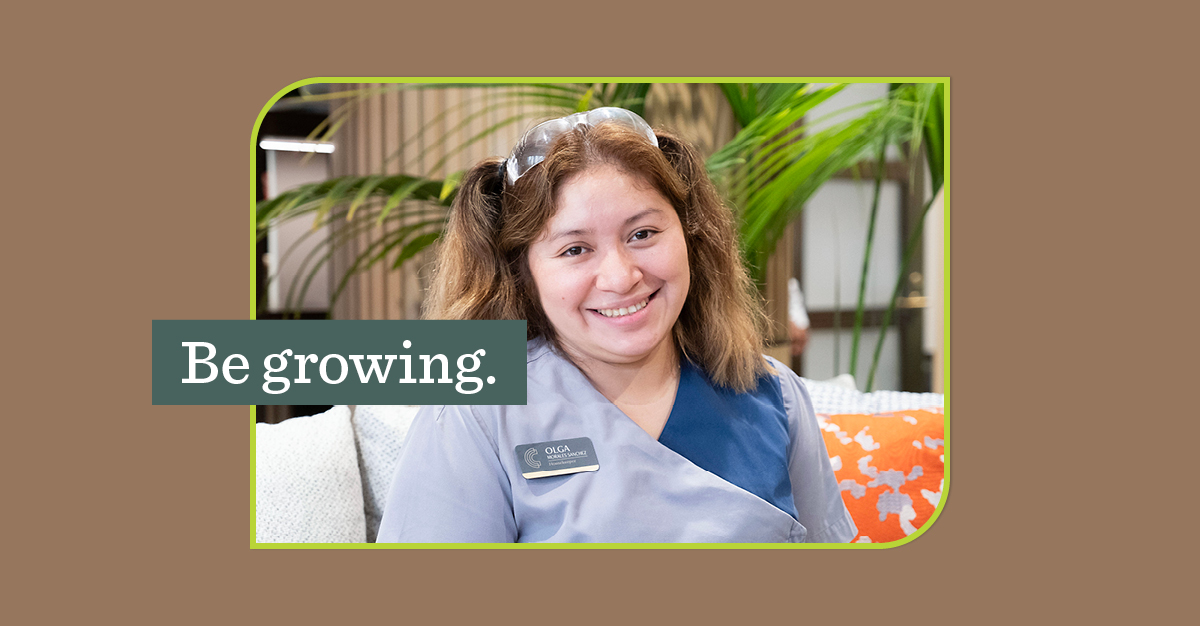 Smiling woman with teal overlay that says "Be growing."