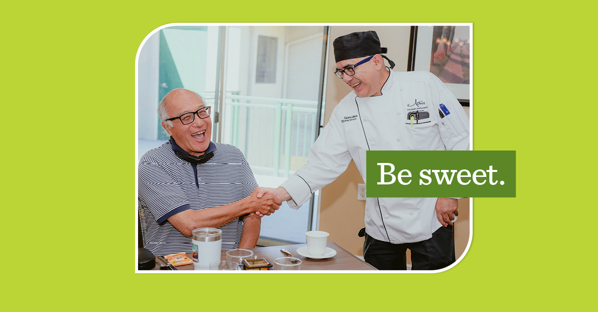 Two men shaking hands with a green overlay that says "Be sweet"