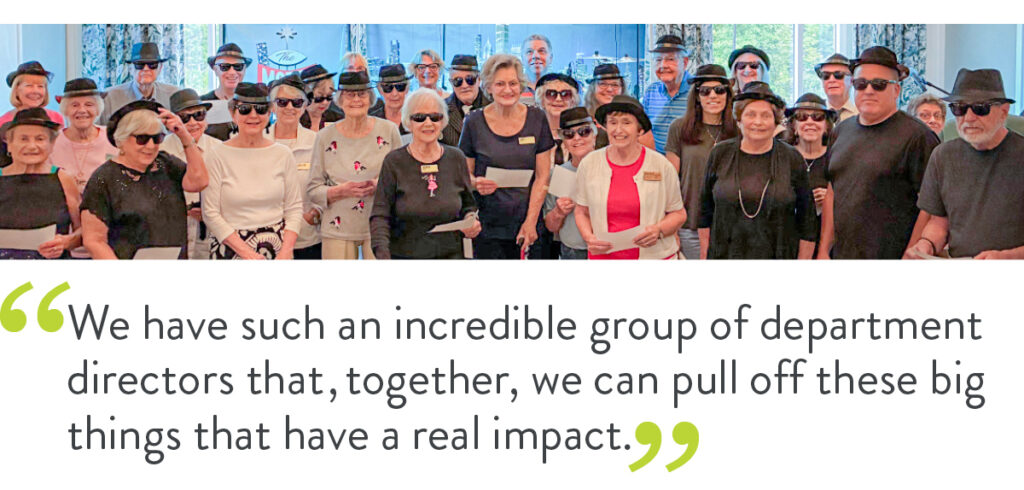 A group of older people and staff members of a senior living community. Underneath them is a quote that reads "We have such an incredible group of department directors that, together, we can pull off these big things that have a real impact."