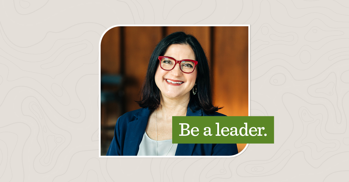 Portrait of Kate smiling, with a green overlay that says "Be a leader"